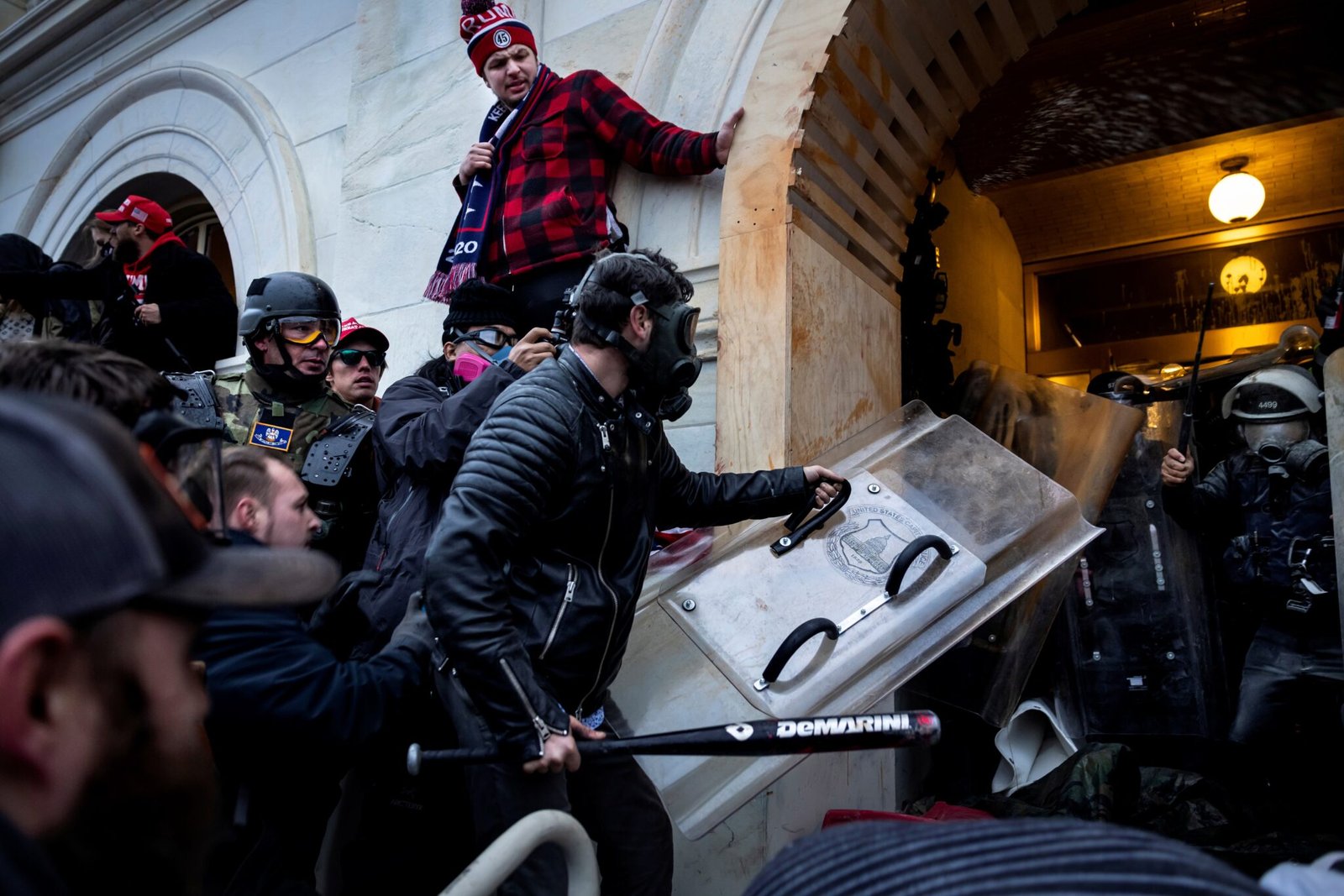 Donald Trump supporters clash with police and security forces as they storm the U.S. Capitol on Jan. 6, 2021 in Washington, D.C. (Photo by Brent Stirton/Getty Images)