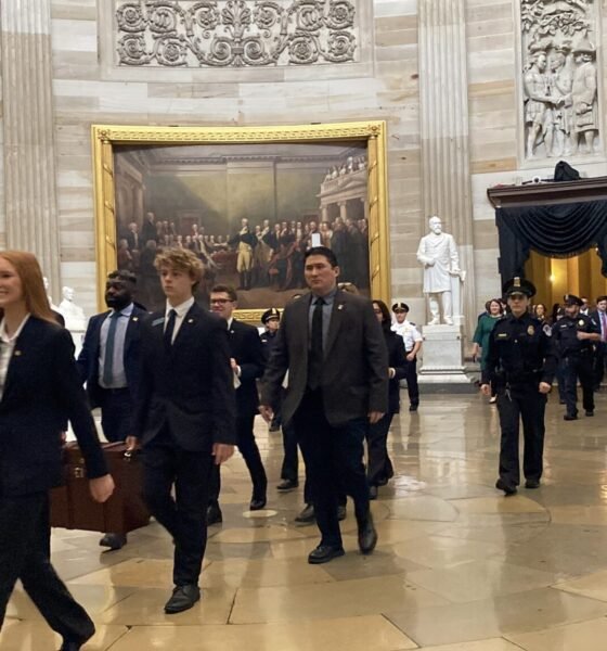 U.S. Senate pages carrying the Electoral College certificates in wooden ballot boxes walk through the Capitol rotunda on their way to the U.S. House chamber on Monday, Jan. 6, 2025. (Photo by Jennifer Shutt/States Newsroom)