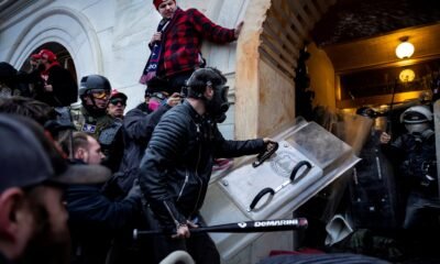 Donald Trump supporters clash with police and security forces as rioters try to storm the U.S. Capitol on Jan. 6, 2021, in Washington, D.C.  (Photo by Brent Stirton/Getty Images)