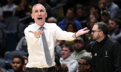 Arizona State coach Bobby Hurley waves players off court after testy finish against rival Arizona