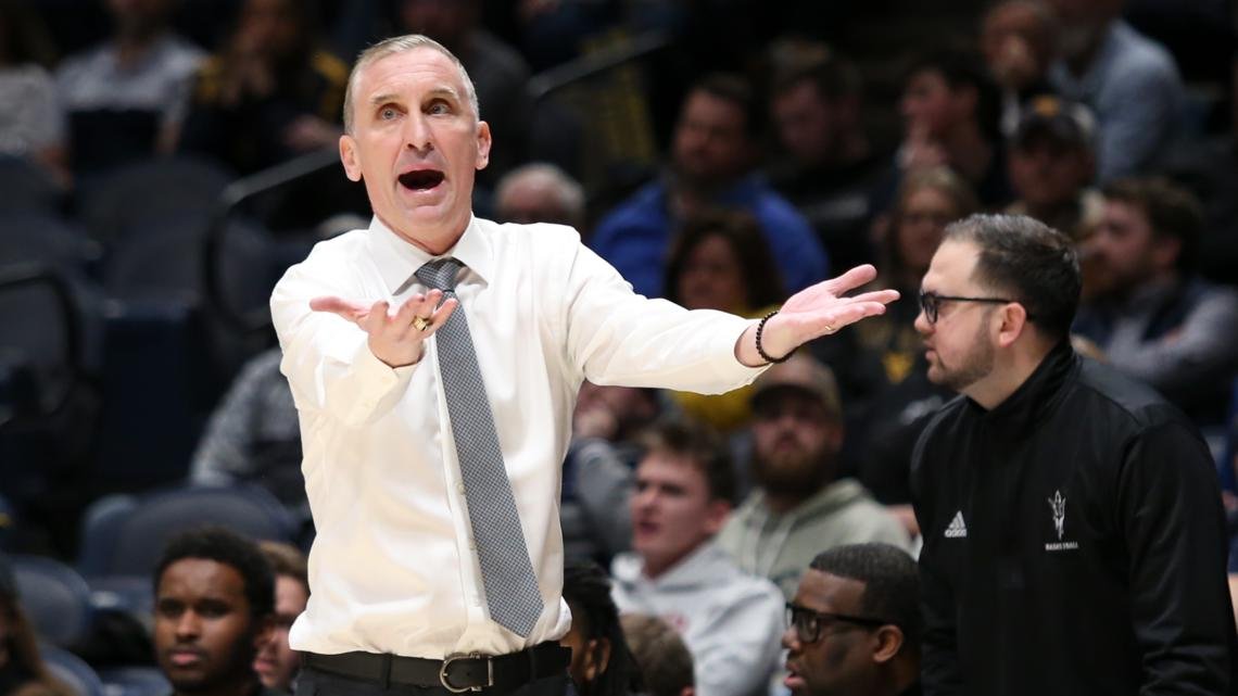 Arizona State coach Bobby Hurley waves players off court after testy finish against rival Arizona