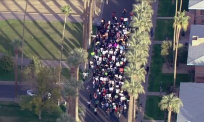 Immigration rights protesters march in downtown Phoenix