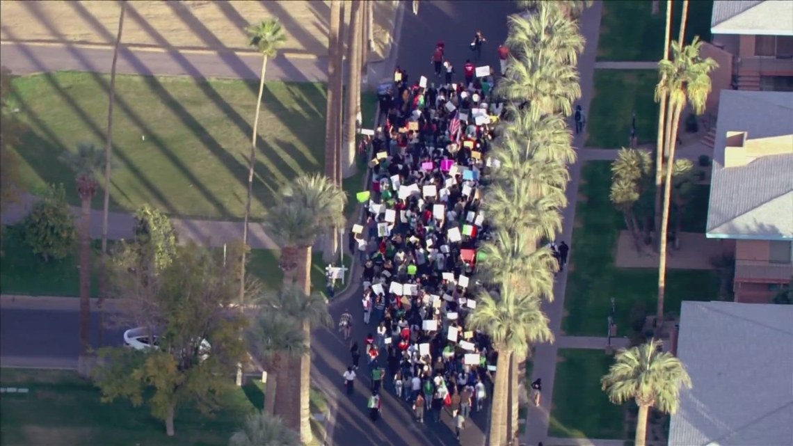 Immigration rights protesters march in downtown Phoenix