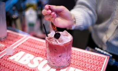 A bartender adds a Luxardo maraschino cherry to a cherry blossom cocktail at Mandy's Wine Bar on Feb. 6, 2025. The creamy cocktail mixes Absolut vanilla vodka with cherry syrup, heavy cream and a splash of pinot noir. [Monica D. Spencer]