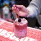 A bartender adds a Luxardo maraschino cherry to a cherry blossom cocktail at Mandy's Wine Bar on Feb. 6, 2025. The creamy cocktail mixes Absolut vanilla vodka with cherry syrup, heavy cream and a splash of pinot noir. [Monica D. Spencer]