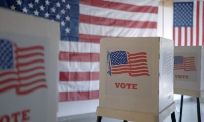 voting booths with American flag