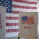 voting booths with American flag