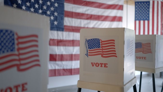 voting booths with American flag