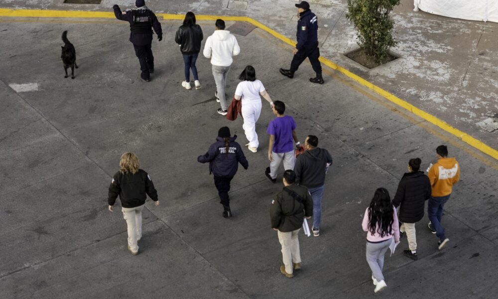 In this aerial view, Mexican immigration officials and police escort deportees after they were sent back into Mexico on Jan. 22, 2025, as seen from Nogales, Arizona.  (Photo by John Moore/Getty Images)