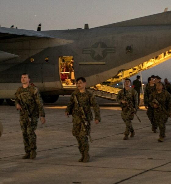 U.S. Marines with the 1st Battalion, 6th Marine Regiment, 2d Marine Division, disembark from a C-130 Hercules at Naval Station Guantanamo Bay, Cuba, on Feb. 1, 2025. The Marines have been deployed there as the Trump administration begins flights to Guantanamo Bay to detain up to 30,000 people who lack U.S. legal status. (U.S. Navy photo by Jovi Prevot)