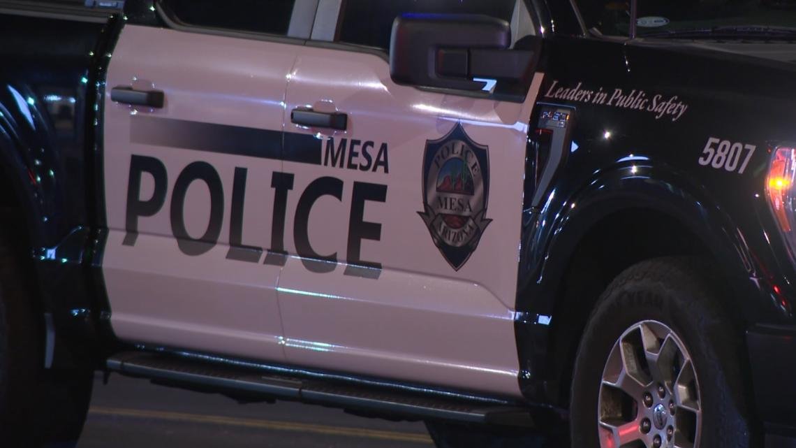 A motorcycle and a car collided in Mesa. The person riding the motorcycle died.