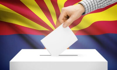 ballot box with Arizona flag in background