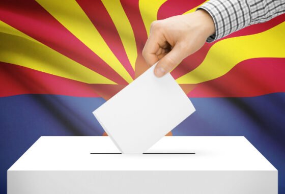 ballot box with Arizona flag in background