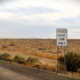 A sign reading "trucks right lane only" sits on the side of Interstate 10 in this undated photo. [Google Maps]