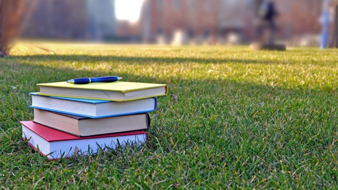 books on campus lawn