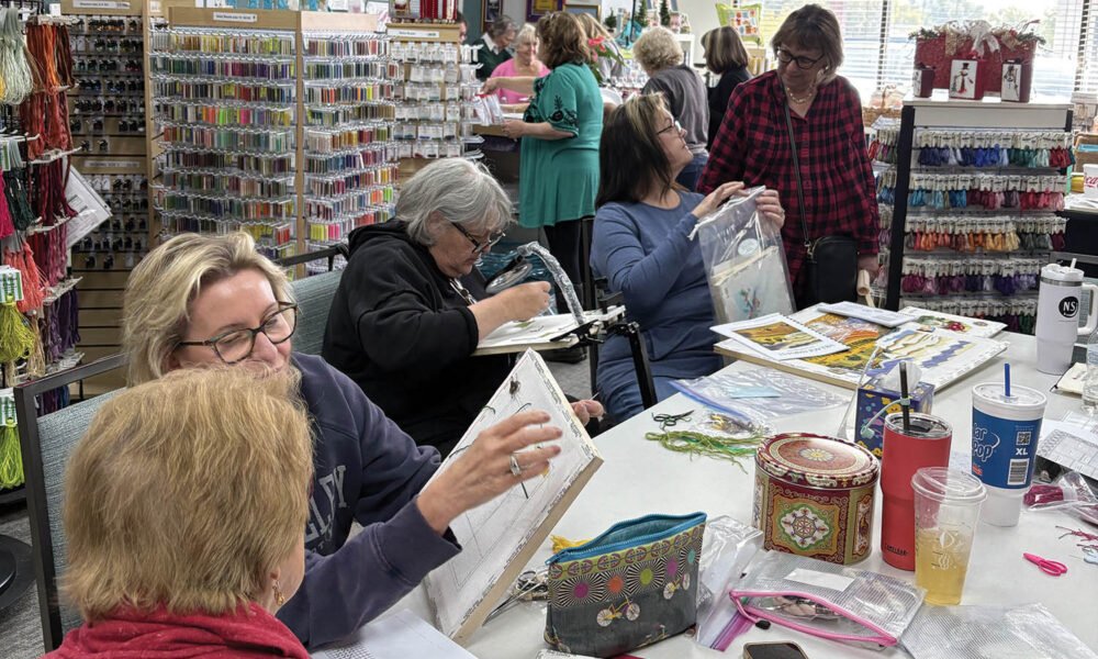 Stitching and sharing at needlework shop