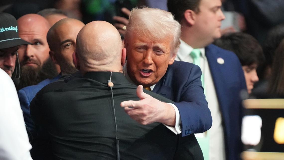 Trump receives a standing ovation as he enters a UFC event in Miami