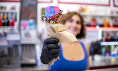 Maricopa Water & Ice co-owner Emilee Thompson holds a scoop of Thrifty ice cream in her store on May 30, 2025. [Monica D. Spencer]