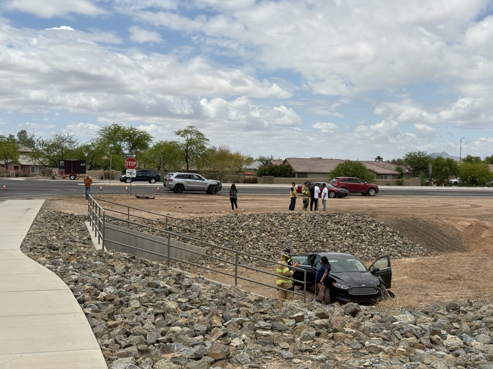 Crash outside hotel sends car into ditch