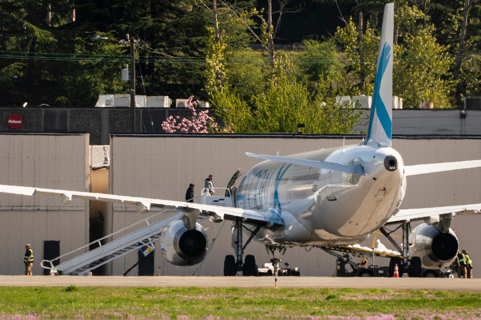 Detainees board a plane chartered by U.S. Immigration and Customs Enforcement at King County International Airport on April 15, 2025 in Seattle, Washington. (Photo by David Ryder/Getty Images)