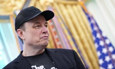Tesla CEO Elon Musk listens as President Donald Trump speaks to reporters in the Oval Office of the White House on May 30, 2025 in Washington, D.C. (Photo by Kevin Dietsch/Getty Images)