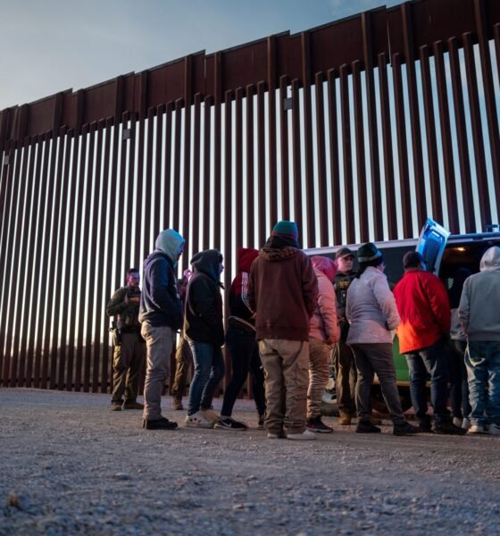 Migrants from Mexico and Guatemala are apprehended by U.S. Customs and Border Patrol officers after crossing a section of border wall into the U.S. on Jan. 04, 2025 in Ruby, Arizona.  (Photo by Brandon Bell/Getty Images)