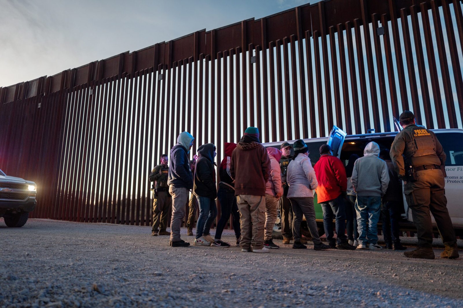 Migrants from Mexico and Guatemala are apprehended by U.S. Customs and Border Patrol officers after crossing a section of border wall into the U.S. on Jan. 04, 2025 in Ruby, Arizona.  (Photo by Brandon Bell/Getty Images)