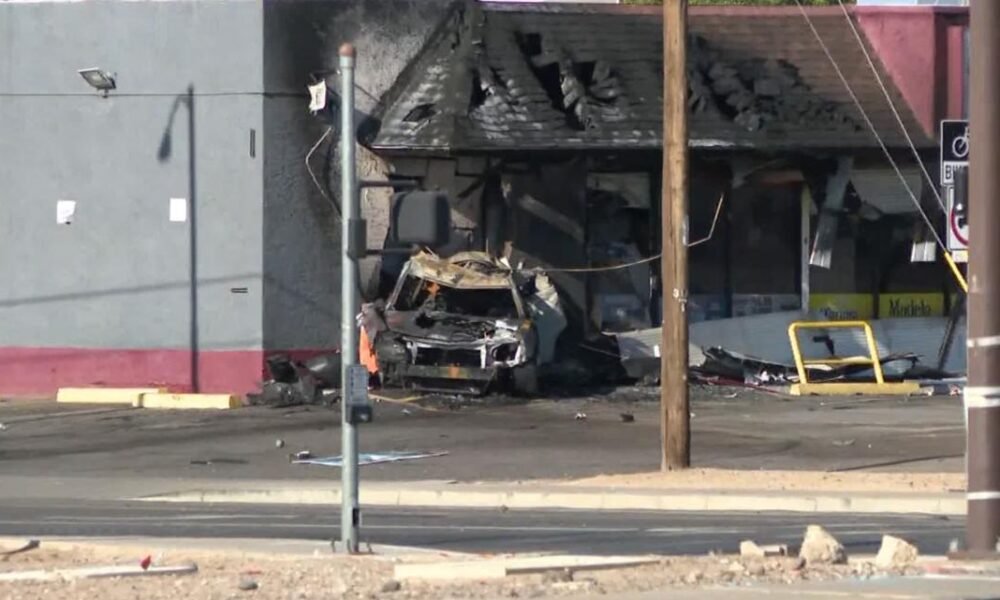 1 dead, 1 injured after vehicle fleeing traffic stop crashes into building, catches fire