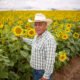 Frank Fierro stands in front of a 90-acre sunflower crop on Ralston Road, just south of State Route 238, on June 2, 2025. [Monica D. Spencer]