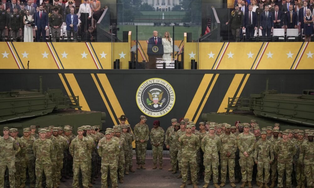 U.S. President Donald Trump and first lady Melania Trump stand together at the end of the U.S Army parade on June 14, 2025 in Washington, D.C. (Photo by Andrew Harnik/Getty Images)