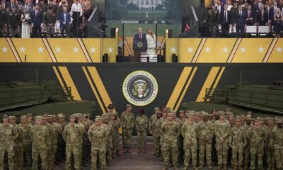 U.S. President Donald Trump and first lady Melania Trump stand together at the end of the U.S Army parade on June 14, 2025 in Washington, D.C. (Photo by Andrew Harnik/Getty Images)