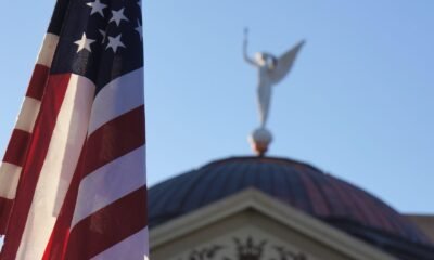 DOJ warns Arizona & Wisconsin over compliance with federal election law