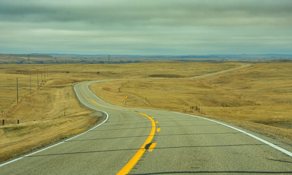 A ribbon of highway stretching to the horizon in North Dakota. (Photo by Getty Images)