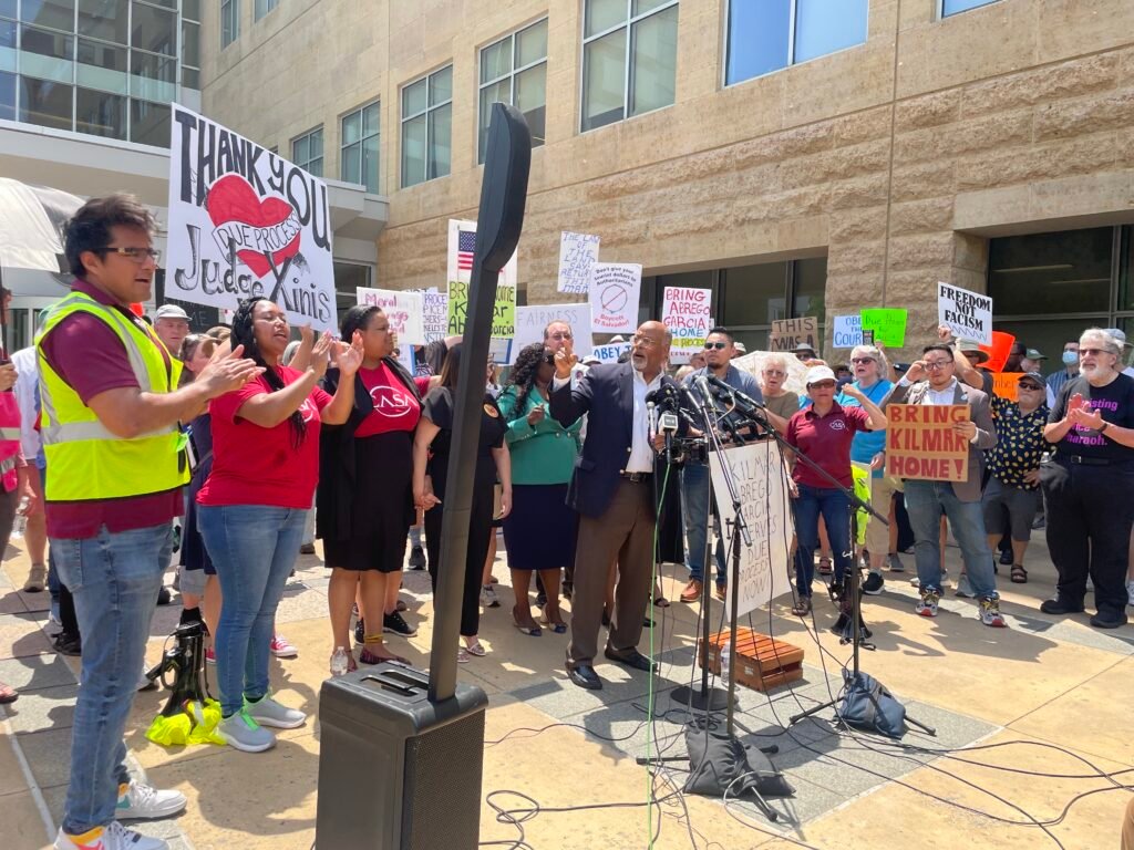 U.S. Rep. Glenn Ivey, a Maryland Democrat who represents the district where Kilmar Abrego Garcia and his wife live, led the chant “bring him home” outside the U.S. District Court in Greenbelt before a hearing in Abrego Garcia’s case last month. (Photo by Ariana Figueroa/States Newsroom)