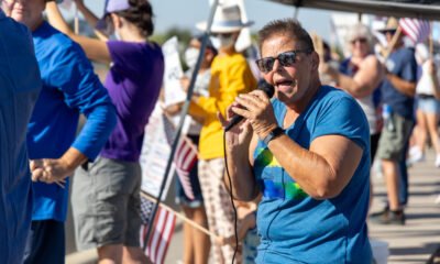 Members of ‘No Kings’ movement protest in large numbers on main strip