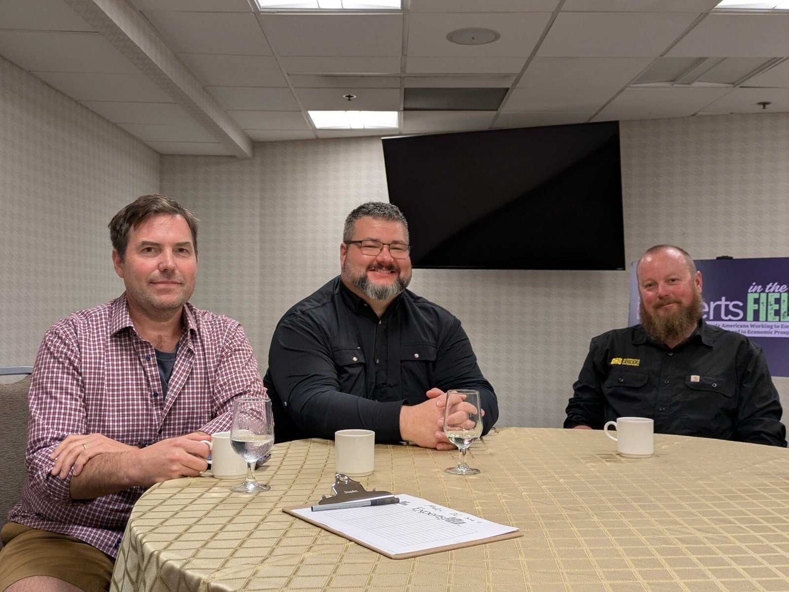 From left to right, Chase Christie, development director for Alaska Solar LLC, Josh Craft, managing partner of Wasilla, Alaska-based Crafty Energy LLC, and Josh Shipley, owner of Alternative Power Enterprises in Ridgeway, Colorado, at the Holiday Inn Express on C Street SW in Washington, D.C., on Wednesday, June 11, 2025, after meeting with staff of U.S. senators about preserving clean energy tax credits in the Republican budget reconciliation bill. (Ashley Murray/States Newsroom)