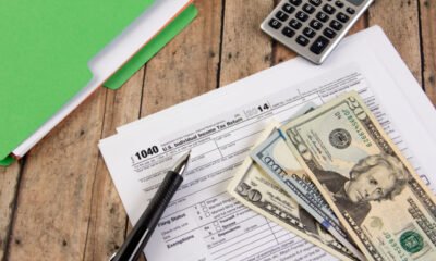 cash with tax documents and calculator