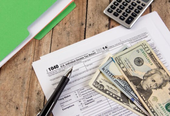 cash with tax documents and calculator