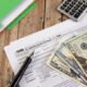 cash with tax documents and calculator