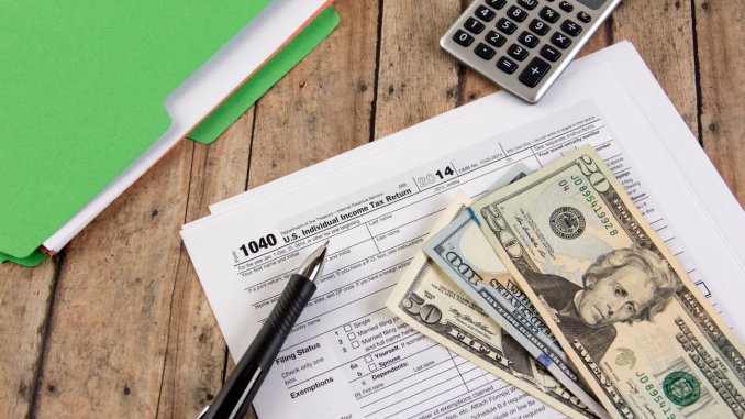 cash with tax documents and calculator