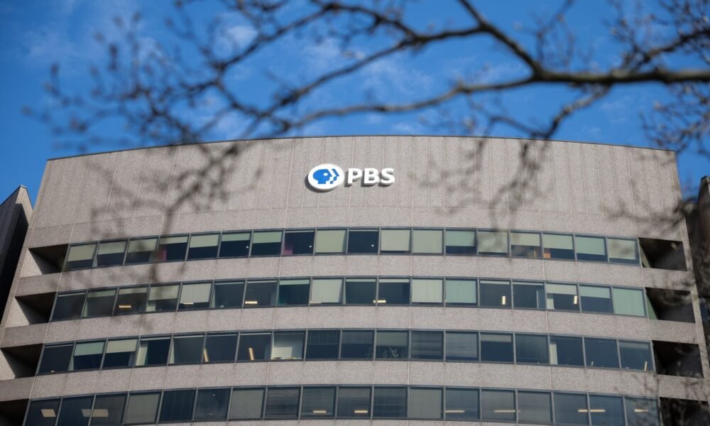 A sign for the Public Broadcasting Service, or PBS,  is seen on its building headquarters on Feb. 18, 2025, in Arlington, Virginia. (Photo by Kayla Bartkowski/Getty Images)