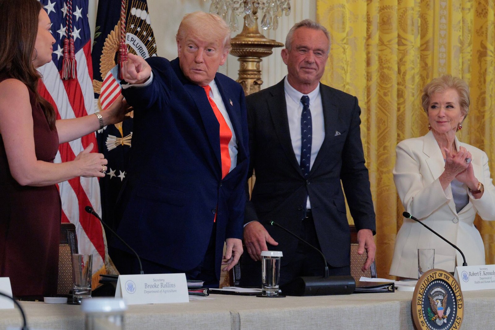 Agriculture Secretary Brooke Rollins, U.S. President Donald Trump, Health and Human Services Secretary Robert F. Kennedy Jr. and Education Secretary Linda McMahon attend an event for the Make America Healthy Again Commission report in the East Room of the White House on May 22, 2025 in Washington, D.C. (Photo by Chip Somodevilla/Getty Images)