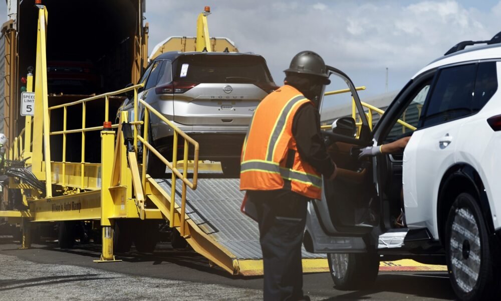 New Nissan cars are driven onto a rail car to be transported from an automobile processing terminal located at the Port of Los Angeles on April 3, 2024, in Wilmington, California.  Tariffs are being levied by President Donald Trump on most foreign vehicles and auto parts.  (Photo by Mario Tama/Getty Images)