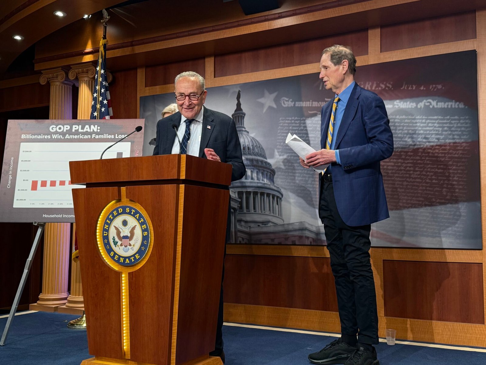 U.S. Senate Minority Leader Chuck Schumer, D-N.Y., speaks during a press conference inside the Capitol building on Wednesday, June 18, 2025. Oregon Democratic Sen. Ron Wyden is at right. (Photo by Jennifer Shutt/States Newsroom)