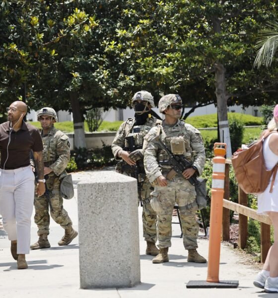 California National Guard members stand guard at an entrance to the Wilshire Federal Building on June 13, 2025 in Los Angeles, California.  (Photo by Mario Tama/Getty Images)