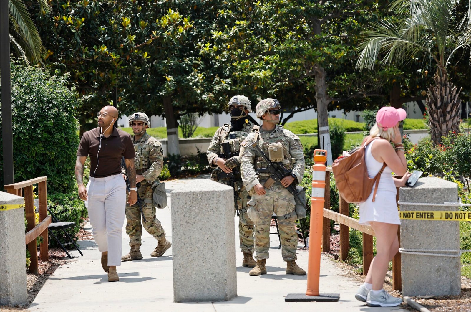 California National Guard members stand guard at an entrance to the Wilshire Federal Building on June 13, 2025 in Los Angeles, California. (Photo by Mario Tama/Getty Images)