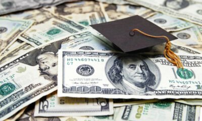 graduation cap on money