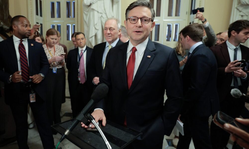 Speaker of the House Mike Johnson, R-La., talks with reporters before heading to the House chamber for a procedural vote on the