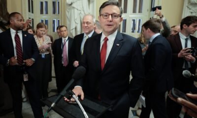 Speaker of the House Mike Johnson, R-La., talks with reporters before heading to the House chamber for a procedural vote on the