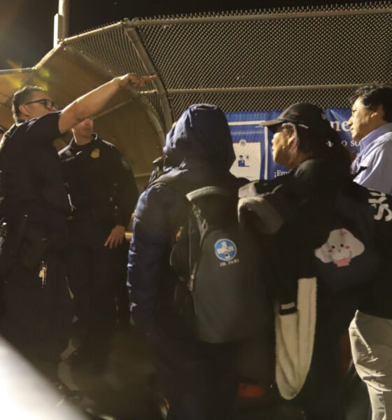 Customs and Border Protection agents question families who have presented themselves at the Paso del Norte bridge to request asylum on May 11, 2023. (Photo by Corrie Boudreaux for Source NM)